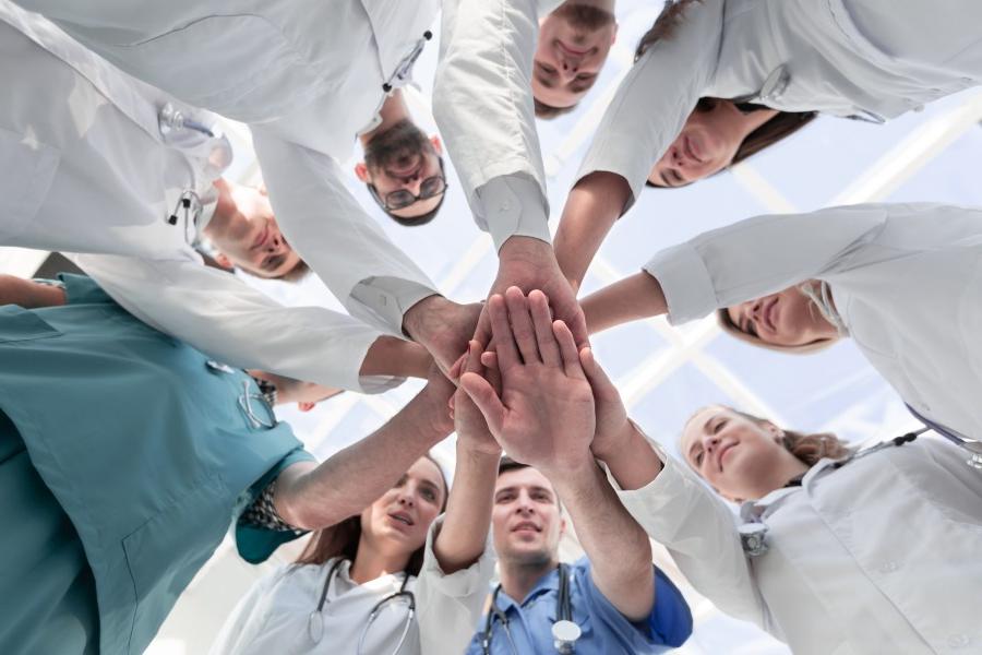 Medical Professionals Touching Hands